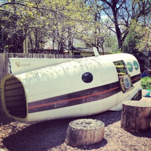 A plane fuselage in the patio... seems logical